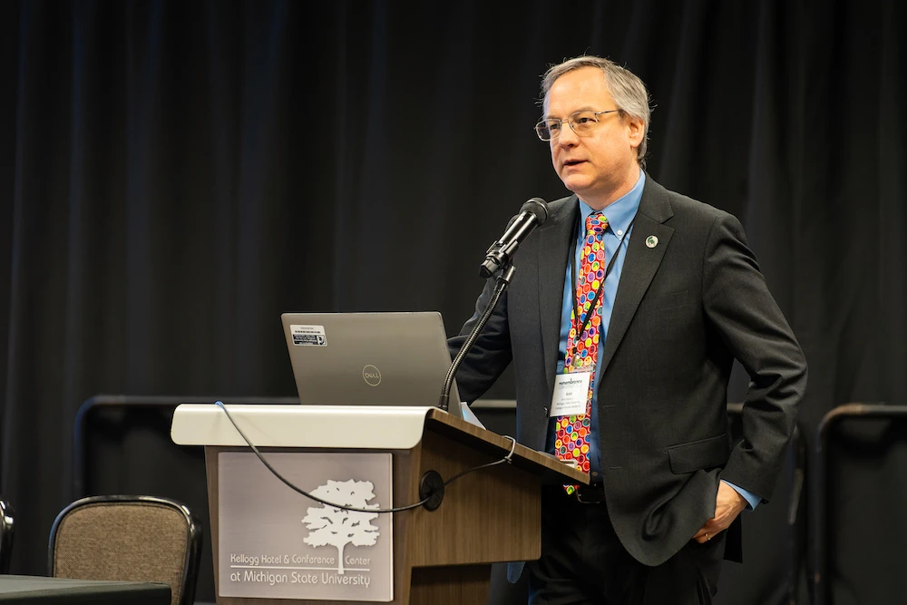 Dean Aron Sousa gives opening remarks at the conference. Photo credit Bryan Esler.