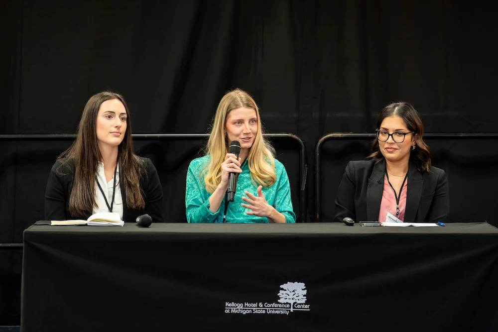 Sadilek, speaks with Kaur, and Sam Shook, a second year medical student, about the work of the MSU SAFE chapter. Photo credit Bryan Esler.